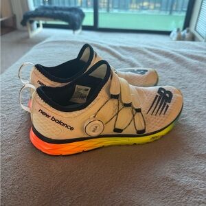 New Balance White Running Shoes with Neon Orange-Yellow Gradient Sole